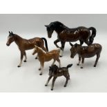 A collection of mainly Beswick horses and foals
