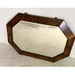 A vintage octagonal oak mirror