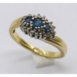 An 18ct gold diamond and sapphire cluster ring, weight 4.3g