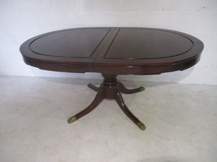 A mahogany dining table with with extendable leaf - total length with leaf 224cm