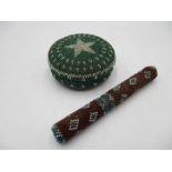 A Beadwork needle case along with a beadwork lidded pot containing a lock of hair