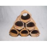 A set of six hexagonal terracotta pipes for wine storage - length 31cm