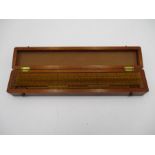 A cased set of wooden rulers by A.J.S & Co.