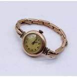A Victorian 9ct rose gold wristwatch with 9ct strap, total weight 20.2g