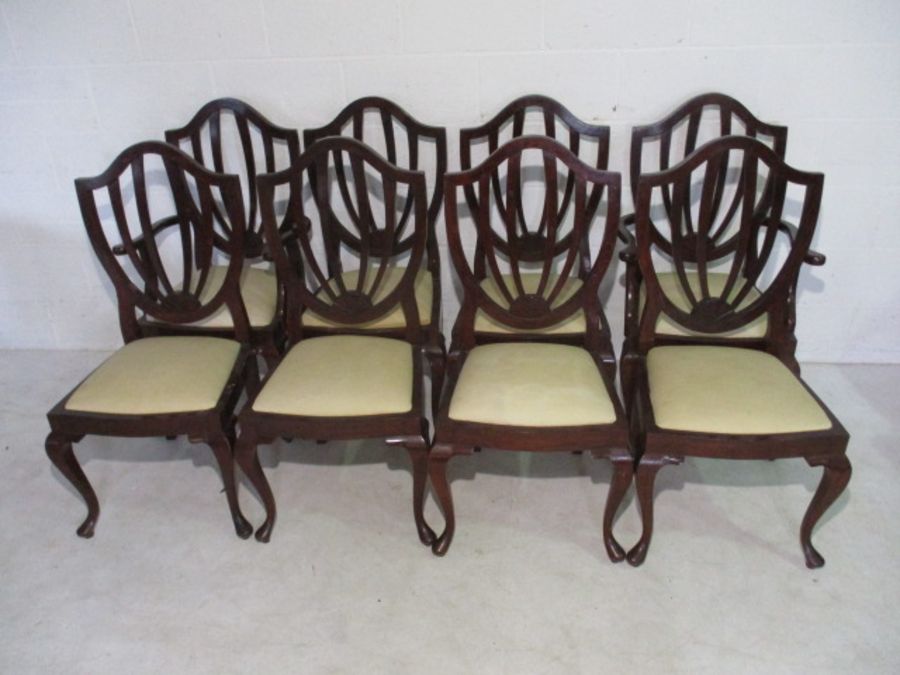 A set of eight shield back dining chairs on cabriole legs, including two carvers