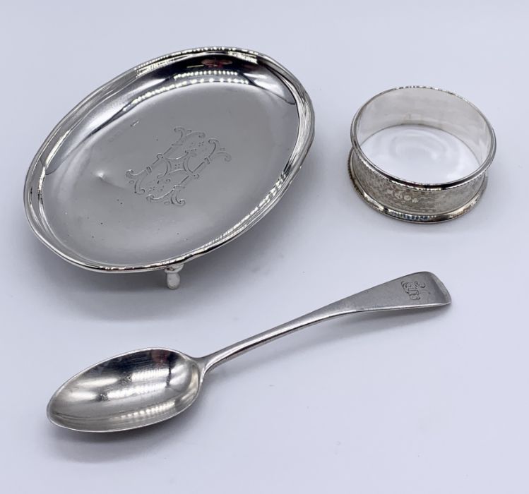 A hallmarked silver pin tray, serviette ring along with a silver coffee spoon
