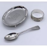 A hallmarked silver pin tray, serviette ring along with a silver coffee spoon