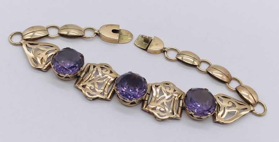 A 14ct gold bracelet set with three amethysts - total weight 12.6g