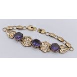 A 14ct gold bracelet set with three amethysts - total weight 12.6g