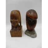 A hand carved wooden bust of an African Queen by Tim Earl, along with an abstract wooden sculpture