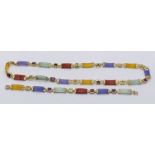 A 14ct gold necklace and matching bracelet set with jade and various gemstones