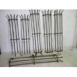 Three pairs of wrought iron tree guards