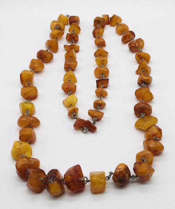 A vintage amber necklace with metal links- total weight 116g