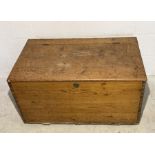 A pine trunk/blanket box with one handle missing