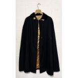 A Gieves Limited London, pure new wool black Cape with gold viscose lining
