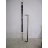 A "Belmans" measuring pole, five ft five inches (65 inches) along with a metal bar bearing the
