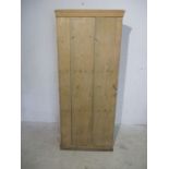 A rustic pine cupboard.