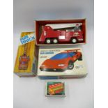 A vintage boxed tin plate Fire Truck with friction siren (MF718), along with a radio controlled