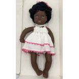 A boxed Gotz black doll - possibly Aurelie in pink dress with matching headband