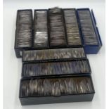 A collection of various worldwide coinage over eight boxes (approx. 1,400 coins)