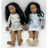 Two black haired Gotz dolls with branded Gotz Clothing