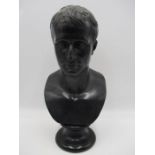 A plaster bust of a gentleman in the Roman style, 35cm height