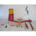 A collection of unfinished radio controlled plane projects, wings and parts etc