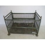 A metal green industrial stackable trolley from Axminster Carpets- length 127cm, depth 79cm,