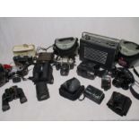 A collection of camera's, binoculars and accessories including Canon, Praktica etc, along with a