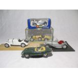 A small collection of Burago cars including Bugatti, Mercedes etc.