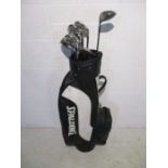 A set of Spalding Paradox golf clubs including irons 3 to 9, sand wedge, pitching wedge and 1