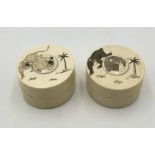 Two Meiji period Oriental circular ivory snuff boxes with etched monkey and tiger designs, some