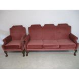 A Queen Anne Style three seater sofa with one chair, on claw and ball feet