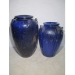 Two large glazed blue garden urns.