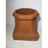 A terracotta chimney pot