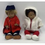 Two Sasha baby dolls in original outfits, one blonde hair "Felix" doll and the other brunette