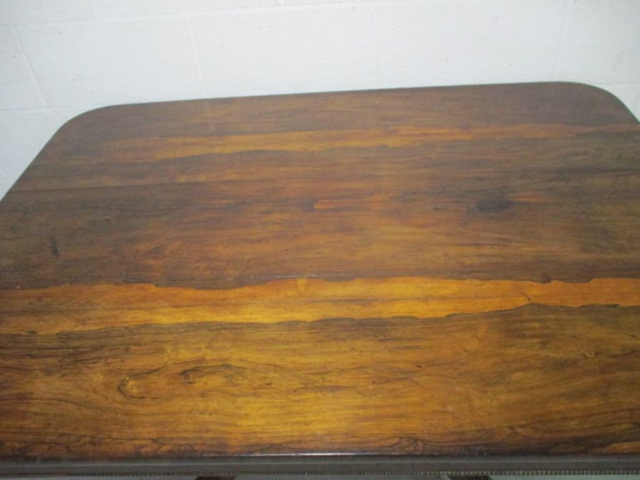 A Victorian rosewood veneered tip up table on quatrefoil legs. - Image 7 of 16