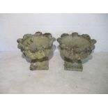 A pair of composite stone gardens pots