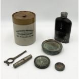 A Fortnum & Mason Stilton jar, hip flask, Georgian bronze weights, cartridge remover by James