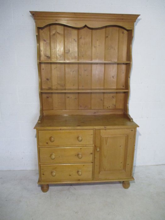 A pine dresser with three drawers and one cupboard under