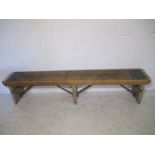 An industrial wooden bench from the Axminster Carpets factory - length 209cm, width 30cm, height