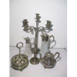 A silver plated four branch candelabra, two claret jugs etc