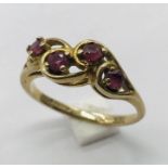 A 9ct gold dress ring set with rubies