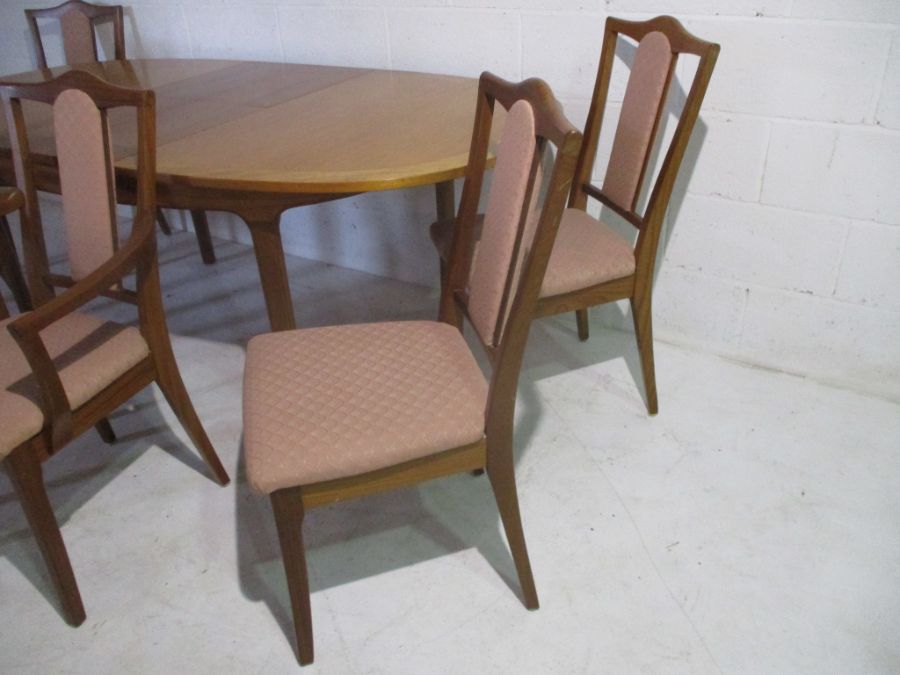 A Nathan extending dining table, along with six matching chairs including two carvers. - Image 3 of 16