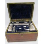 A 19th Century Baxter, Cockspur St. London rosewood and brass inlaid travelling toilet set