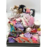 A collection of mainly Barbie clothing, accessories and horses