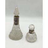 Two cut glass scent bottles with hallmarked silver collars