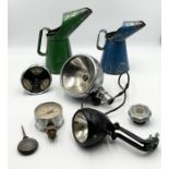A collection of various car related parts including oil cans, headlamps, Smiths Amperes/oil/petrol