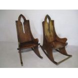 A pair of gothic revival rocking chairs - one missing foot rest