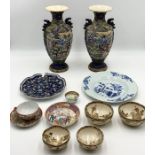 A collection of Oriental china including a pair of vases A/F and a collection of Satsuma bowls etc.